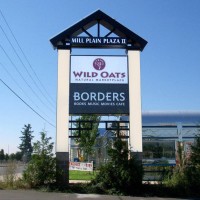 A double faced illuminated multi-tenant freestanding sign.